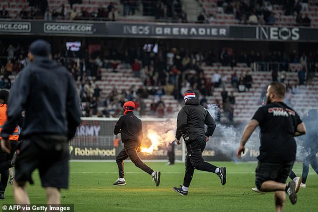 OGC Nice ultras storm the pitch in ugly scenes after the Ineos-owned side are condemned to Ligue 1 relegation play-off